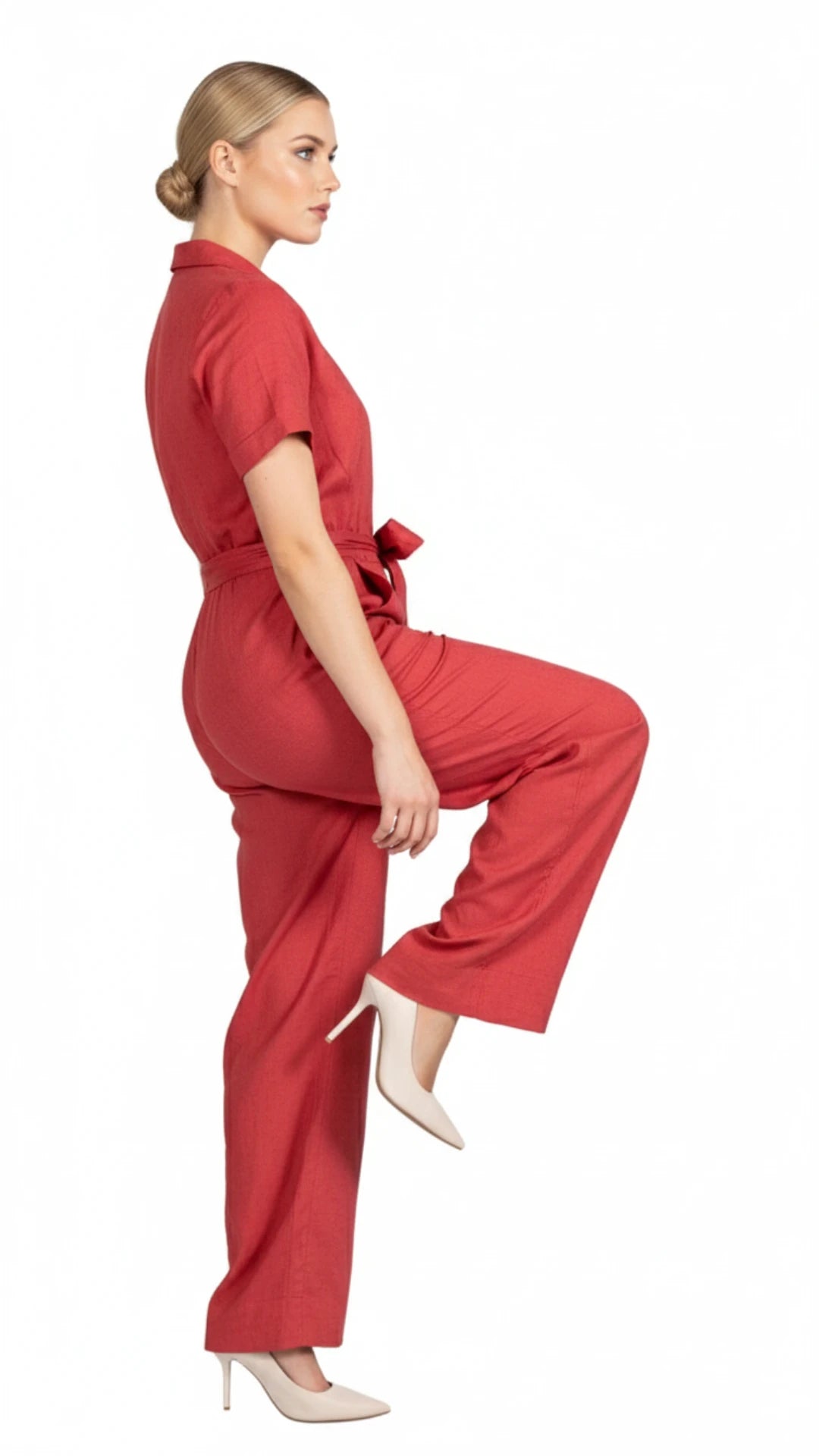 Model wearing a showing the comfort of wearing Karee's Linen Jumpsuit