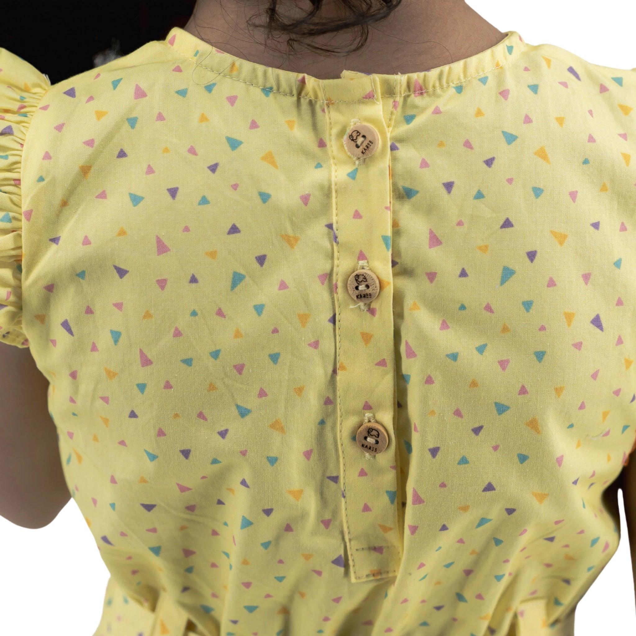 Close-up of the back of a woman's Karee Lemon Meringue Cotton V-Neck Jumpsuit for Girls with colorful triangle patterns and decorative buttons.