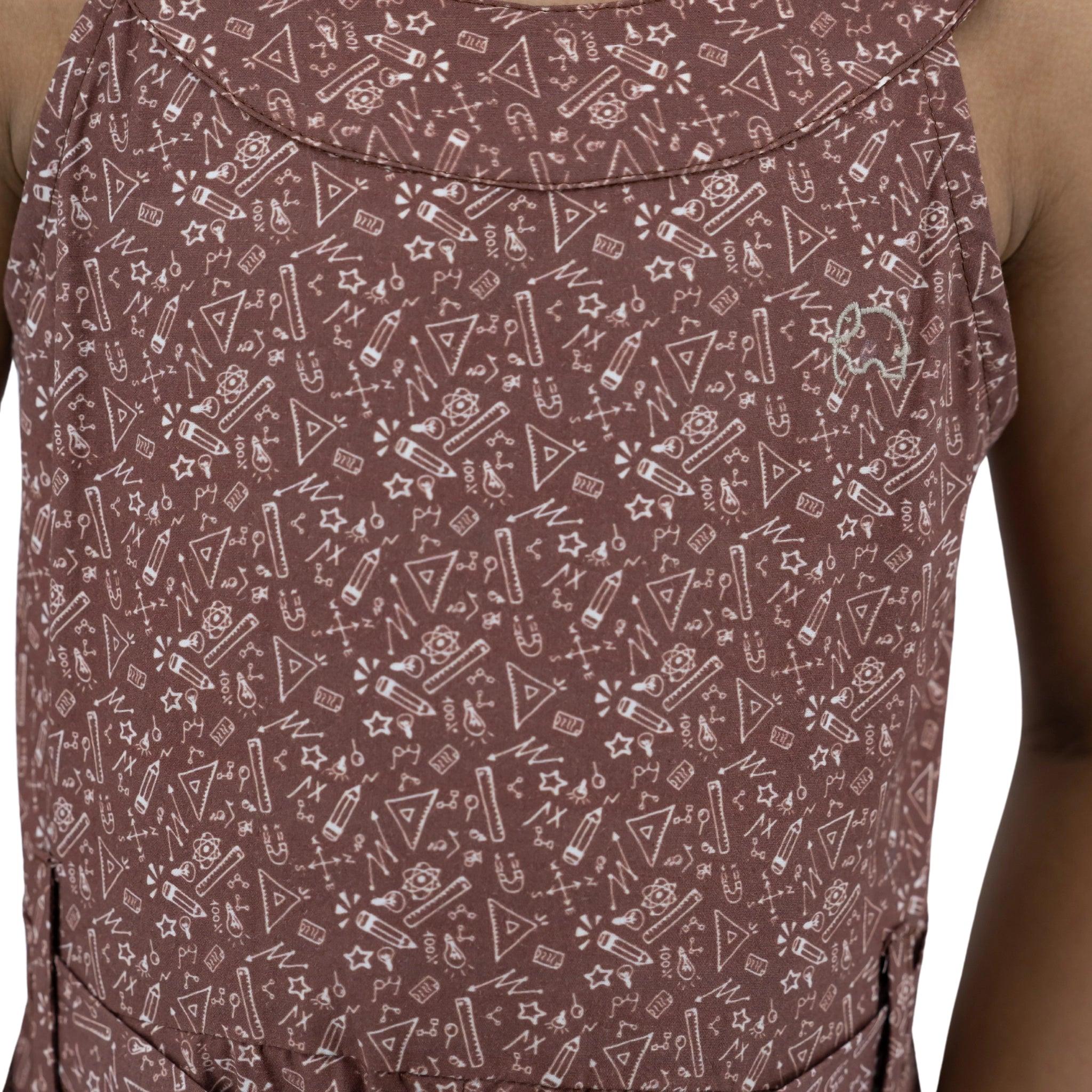 Close-up of a cocoa brown cotton jumpsuit for girls with white geometric designs, focusing on the sustainable fabric's texture on a person's upper back by Karee.