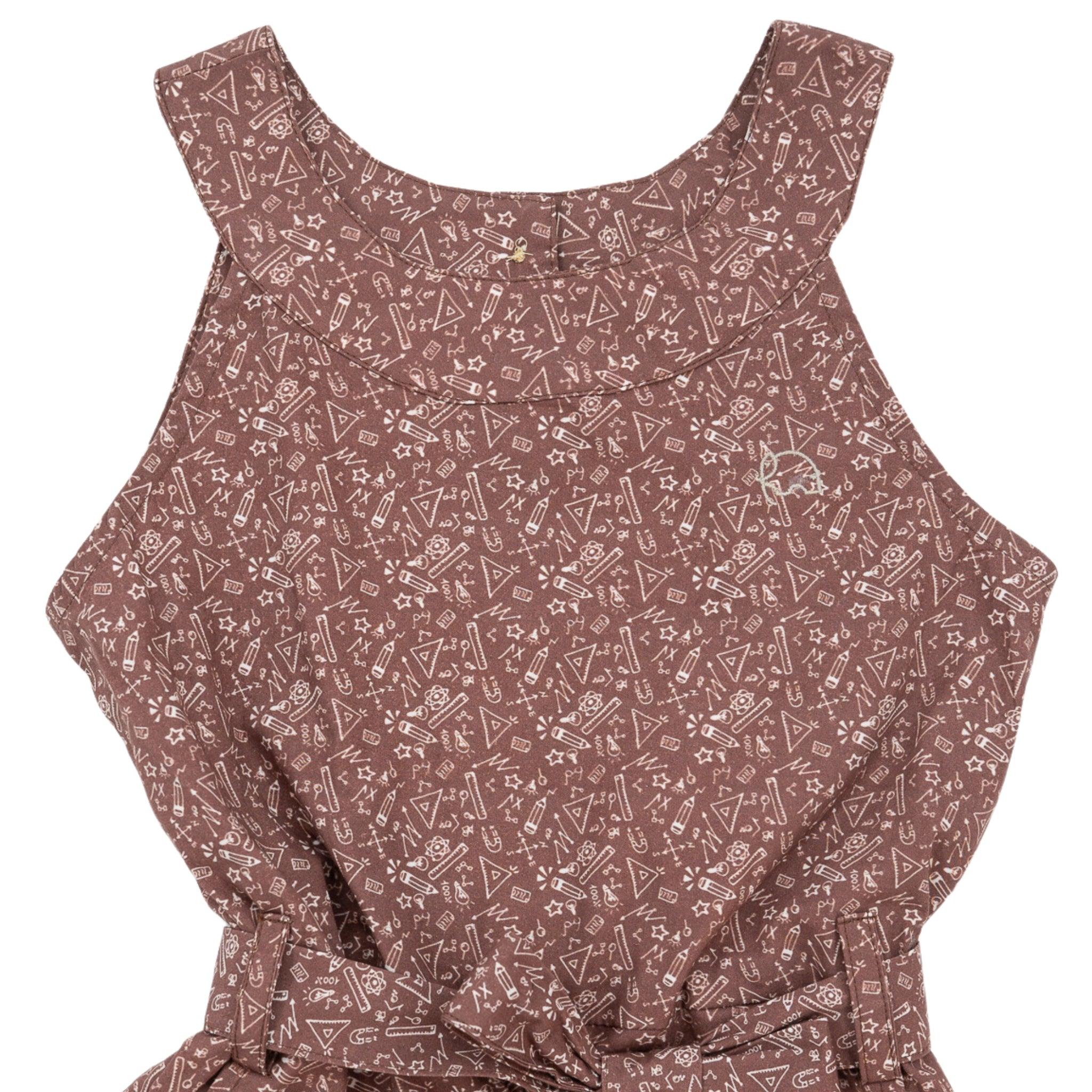 Close-up of a sleeveless, mauve top with an intricate white geometric pattern, featuring a ruffled detail and crafted from eco-friendly style fabric.