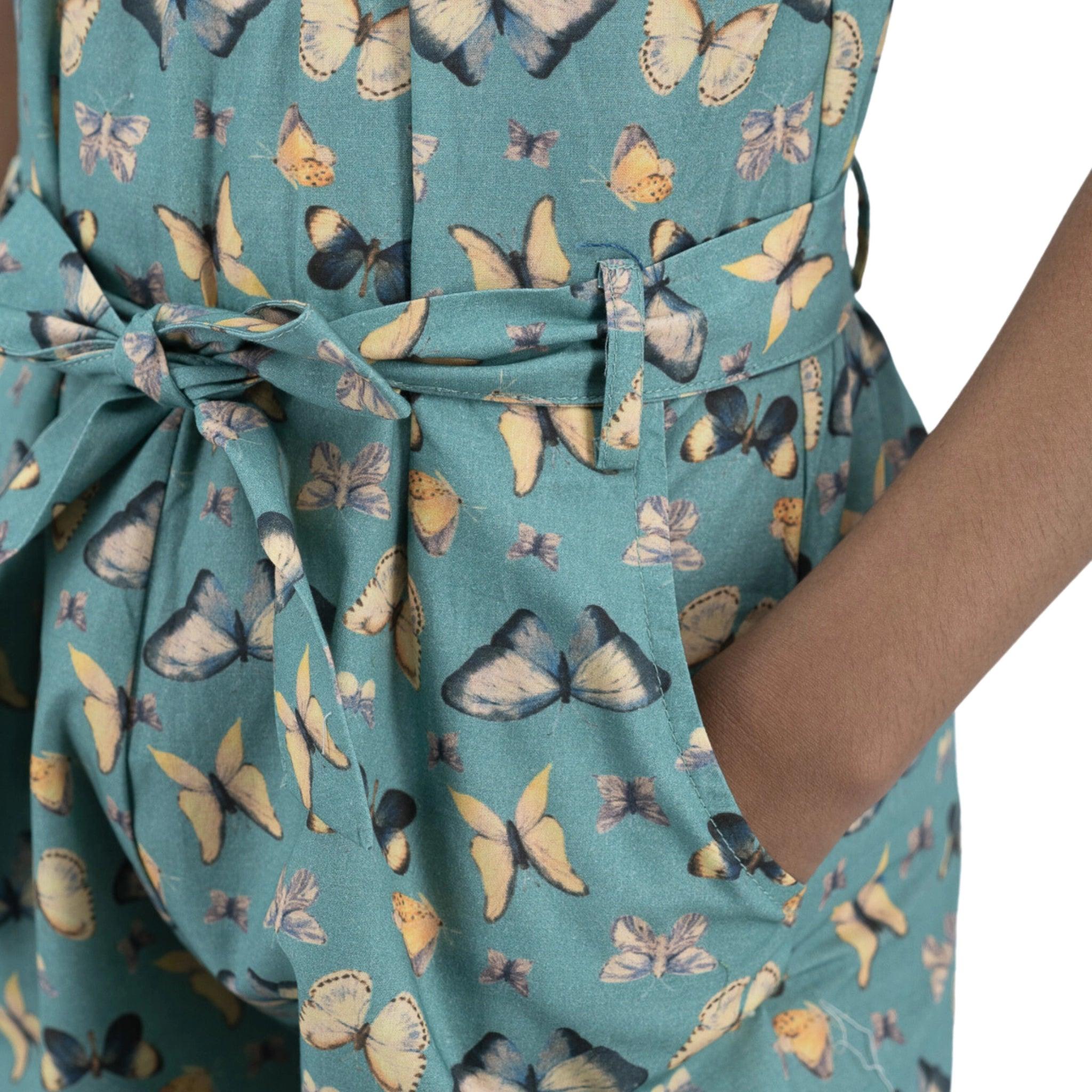 Close-up of a Blue Surf Adventure-ready Cotton Play Suit by Karee with a butterfly pattern and a bow detail on the back.