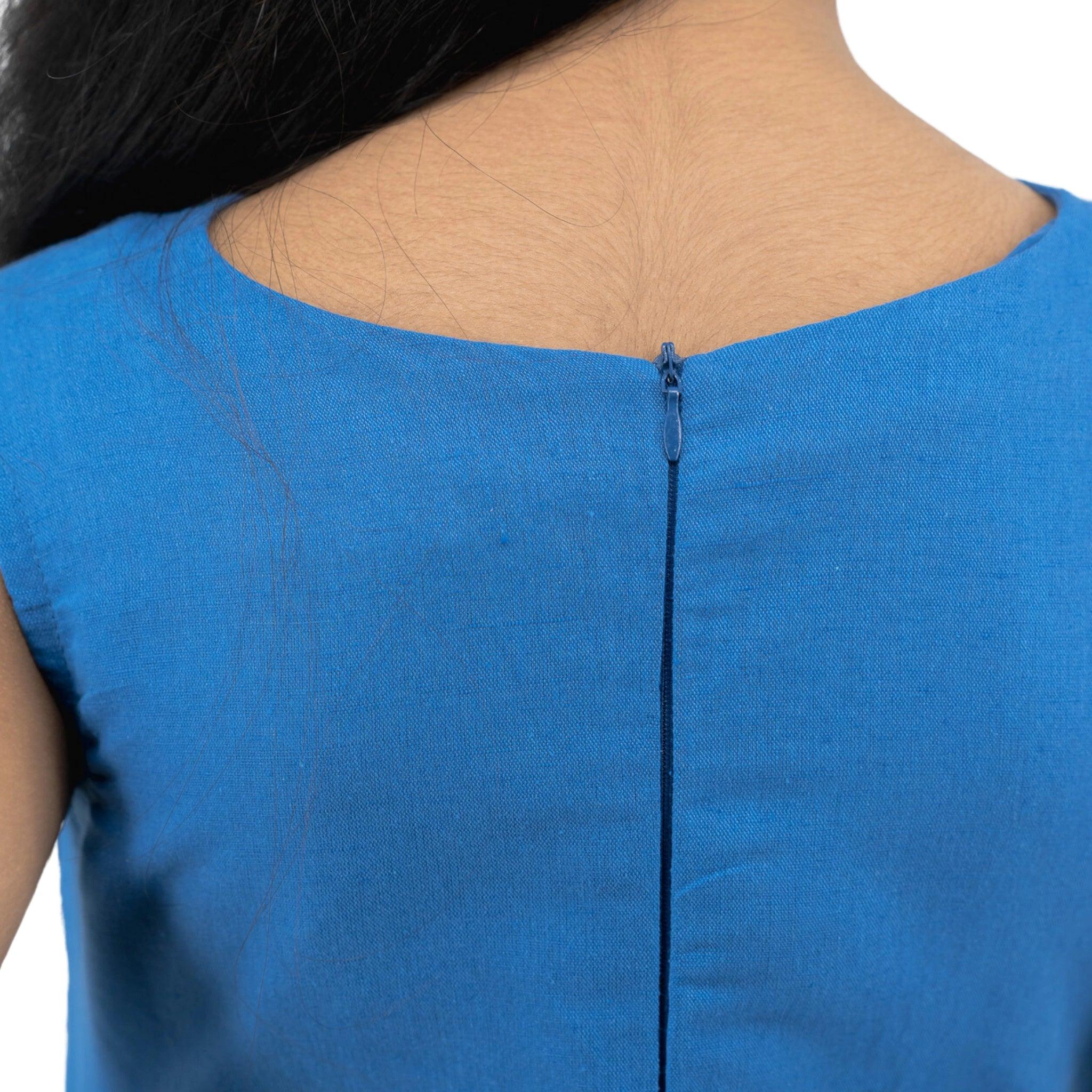 Close-up of a woman's back wearing a Karee Linen Cotton Round Neck Frock for Kids with a zipper detail.