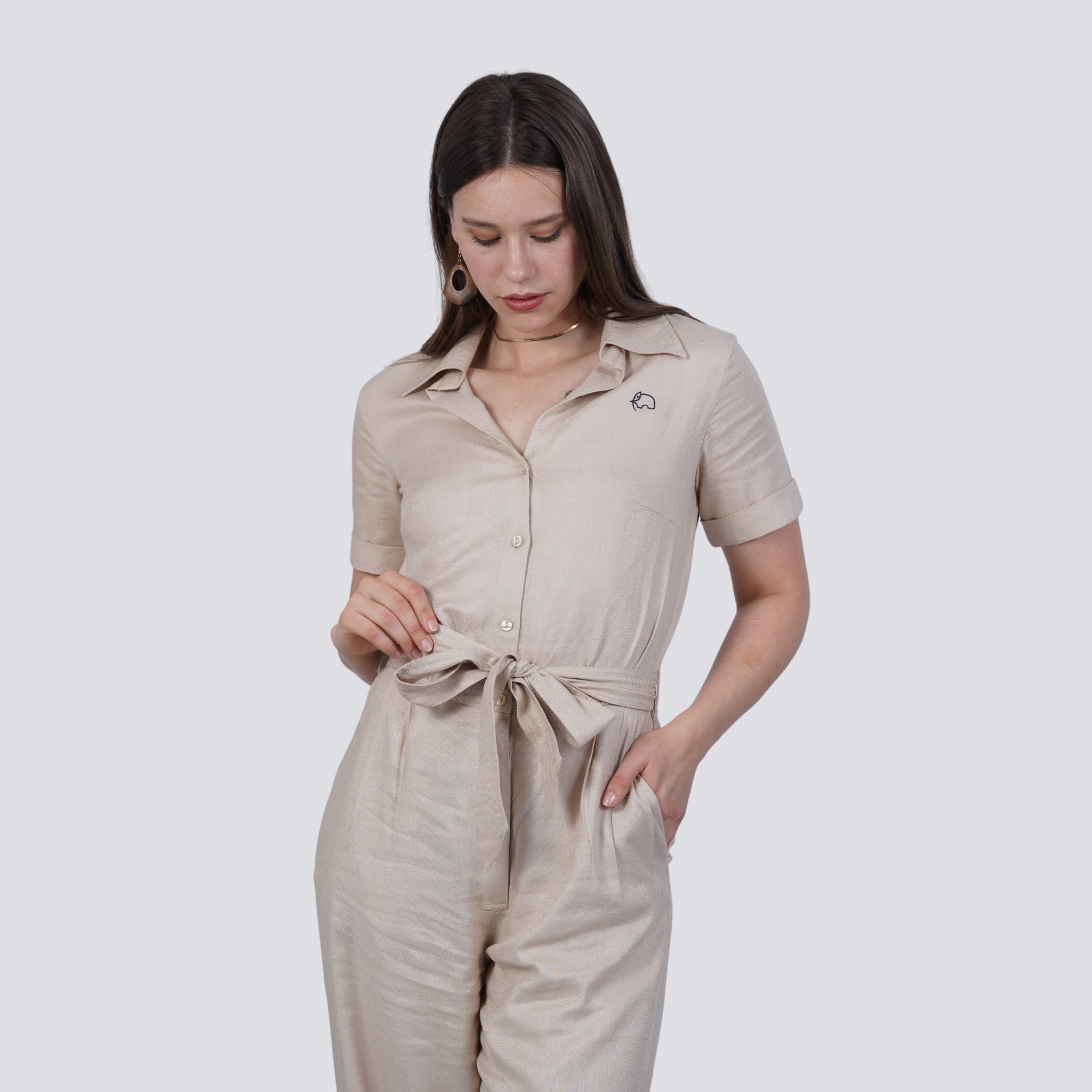 A woman wearing a Merino Viscose Linen Jumpsuit, sustainable and ethically made, comfortable linen jumpsuit for Women