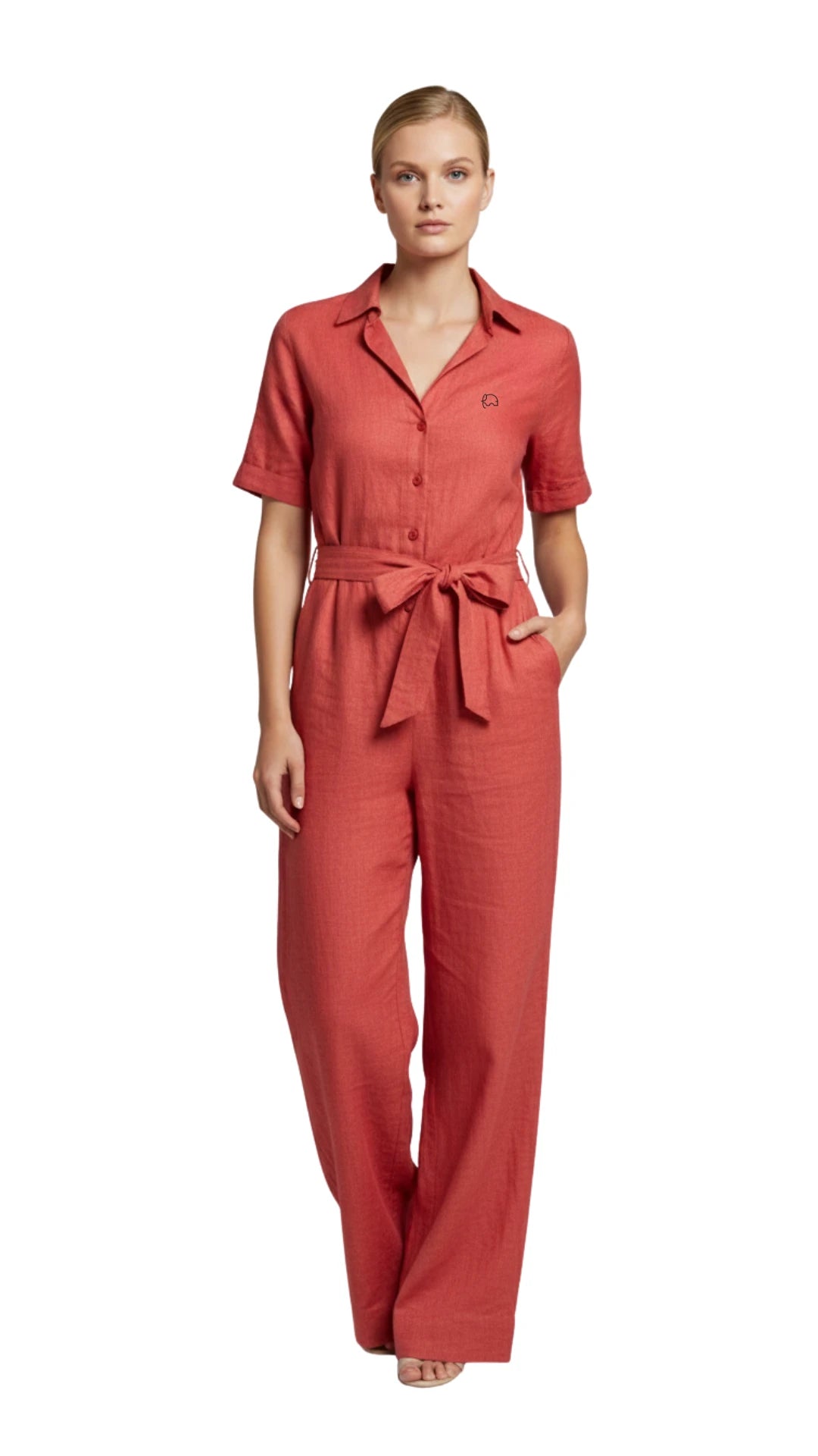 Model posing wearing Karee Linen sustainable jumpsuit for women, walking style
