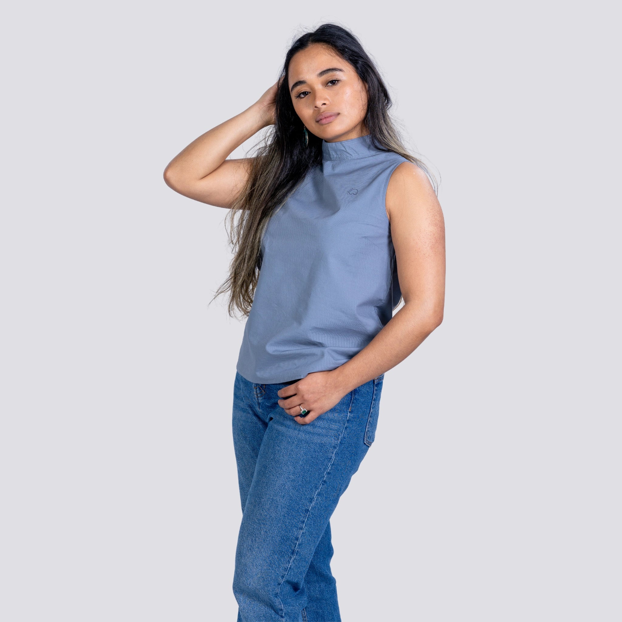 A woman wearing Karee Grey Linen Sleeveless Top, Office wear for woman, comfortable and made of natural fibres